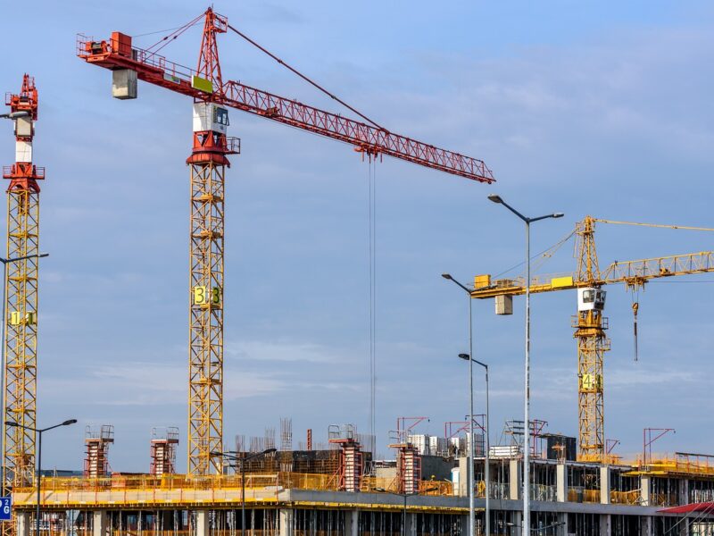 Three Yellow Tower cranes on a building site