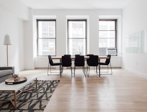 flat with wooden floor, sofa and dinning table and chairs
